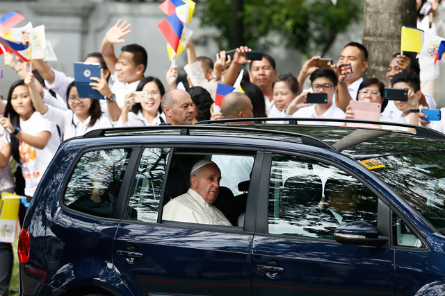 Pope Francis aboard a covered vehicle prior to his meeting with President Benigno Aquino III at the Malacanang Palace in Manila on January 16, 2015. Photot by Dennis Sabangan/EPA