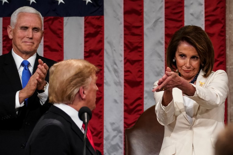 CONDESCENDING APPLAUSE. House Speaker Nancy Pelosi applauds President Donald Trump as he delivers the State of the Union address at the US Capitol in Washington, DC on February 5, 2019. Photo by Doug Mills/Pool/AFP   