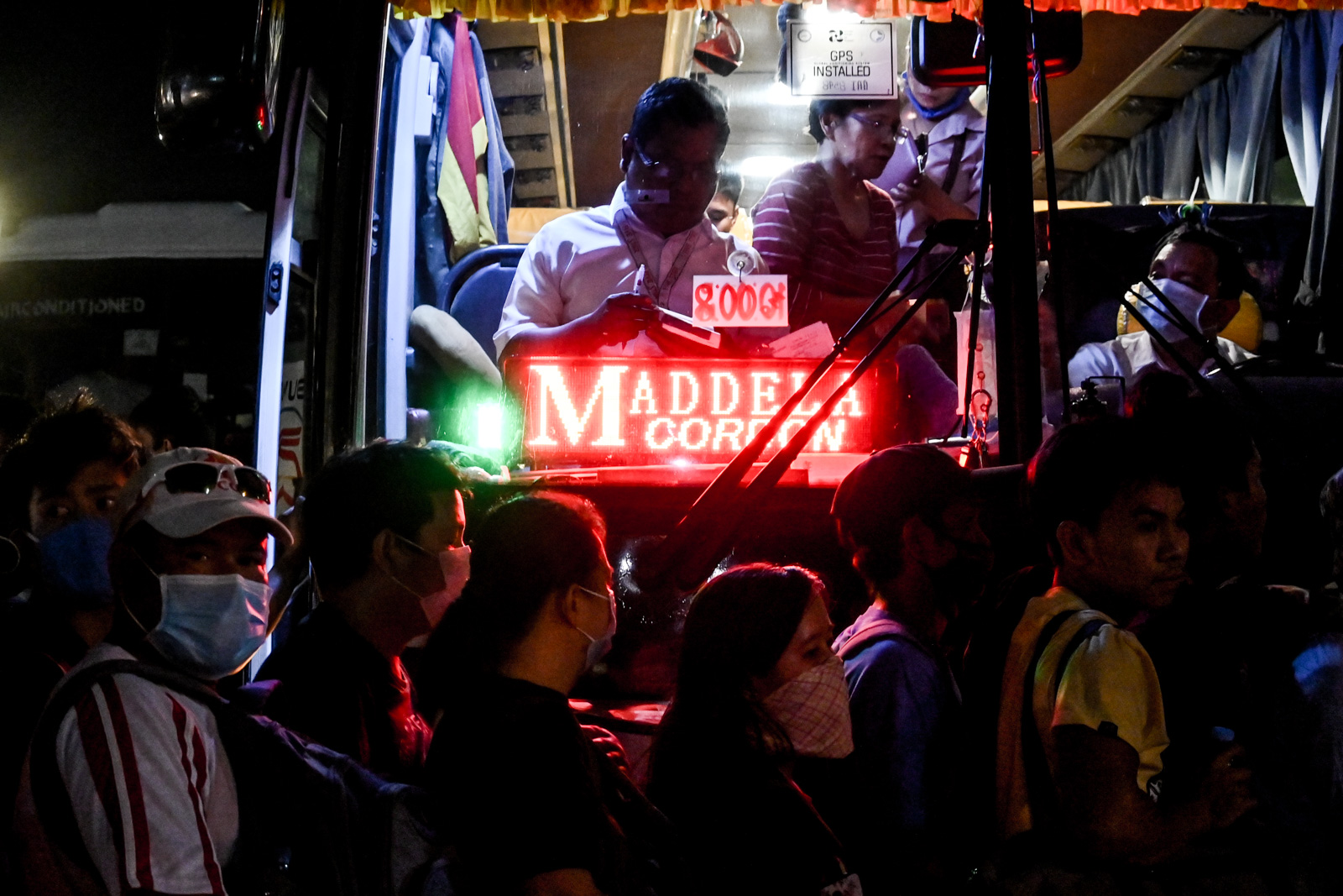 RUSH. Commuters, hoping to leave Manila before the travel ban, flock to a bus terminal in Cubao, Quezon City on Friday, March 13, 2020. Photo by Alecs Ongcal/Rappler 