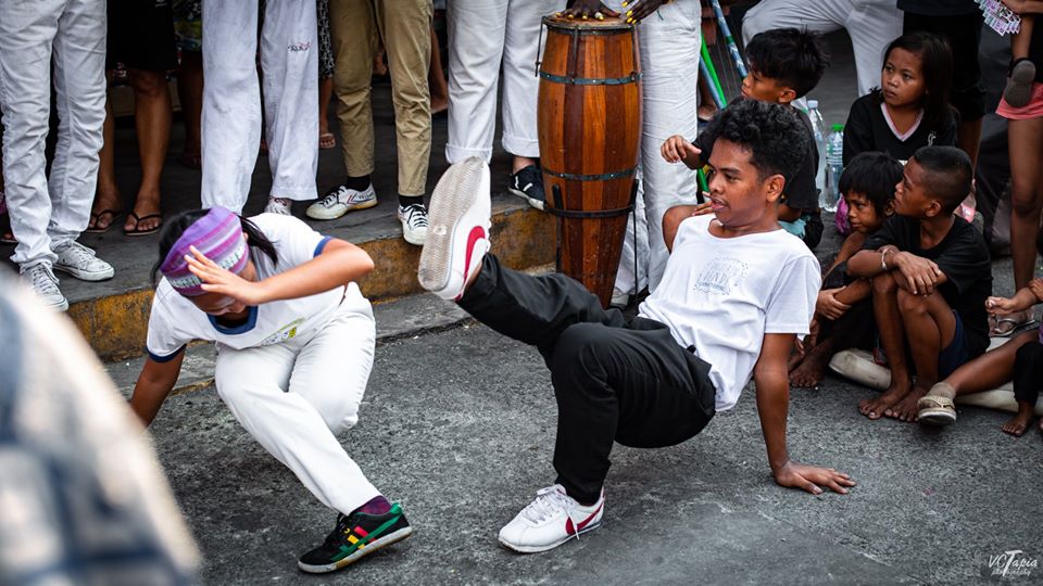 ENGAGING SPORT. Capoeira Angola combines the rhythmic movements of martial arts, dance and acrobatics to engage, rather than hurt, the opponent. Photo by VCTapia Photography 