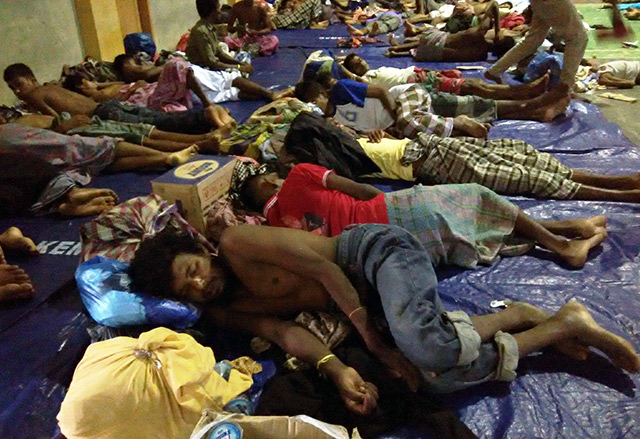 SHELTER. Rescued migrants from Myanmar and Bangladesh sleep side by side at a sports hall in North Aceh. This is better than the boat they traveled in from Myanmar, where they couldn't even stretch their legs. Photo by Nurdin Hasan/Rappler    