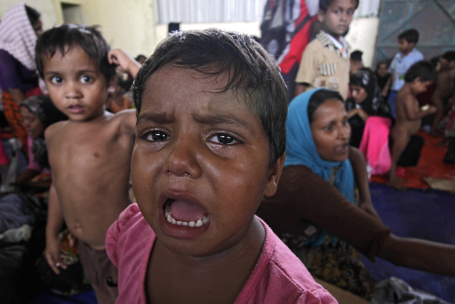 HUNGRY. A child crying at the refugee camp for Rohingya and Bangladeshi migrants in Kuala Langsa, Aceh, on May 15, 2015. Photo by EPA  