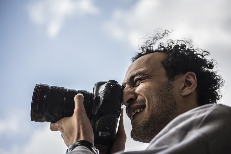 FREED. Egyptian photojournalist Mahmoud Abu Zeid, widely known as Shawkan, carries a camera at his home in the capital Cairo on March 4, 2019. Photo by Khaled Desouki/AFP 