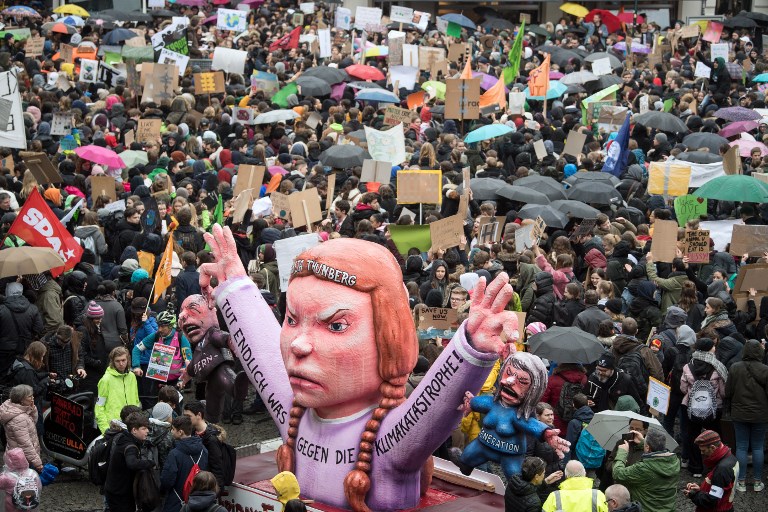 'NO PLANET B.' Youths demonstrate with banners and placards during the 'Fridays For Future' movement on a global day of student protests aiming to spark world leaders into action on climate change on March 15, 2019 in Duesseldorf, western Germany. Photo by Federico Gambarini/dpa/AFP  