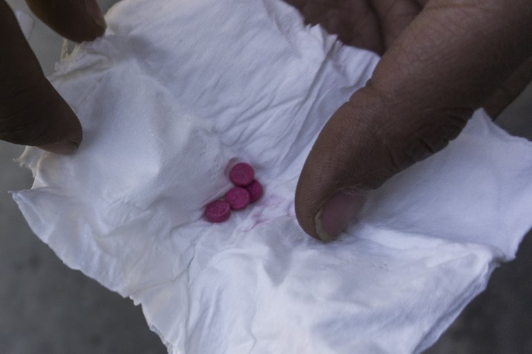 MYANMAR METH BUST. This photo taken on January 11, 2019 shows a drug user user holding low-grade crystal meth tablets, known in Southeast Asia as "yaba", in Muse, Shan State, along Myanmar's border with China. File photo by Ye Aung Thu/AFP 