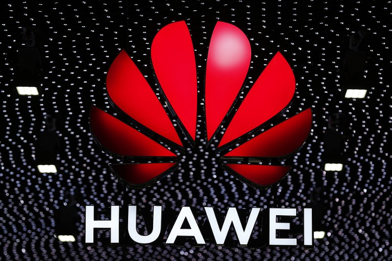 HUAWEI'S 5G DEALS. The Huawei logo is displayed at the Mobile World Congress (MWC) in Barcelona on February 26, 2019. Photo by Pau Barrena/AFP 