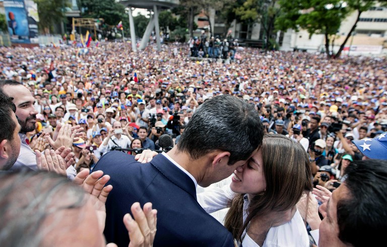 COMING HOME. Handout photo released by Venezuelan opposition leader and self-proclaimed acting president Juan Guaido's photography service showing as he looks at his wife Fabiana Rosales during a rally upon their return in Caracas on March 4, 2019. Photo by Donaldo Barros/Juan Guaido's photography service/AFP 