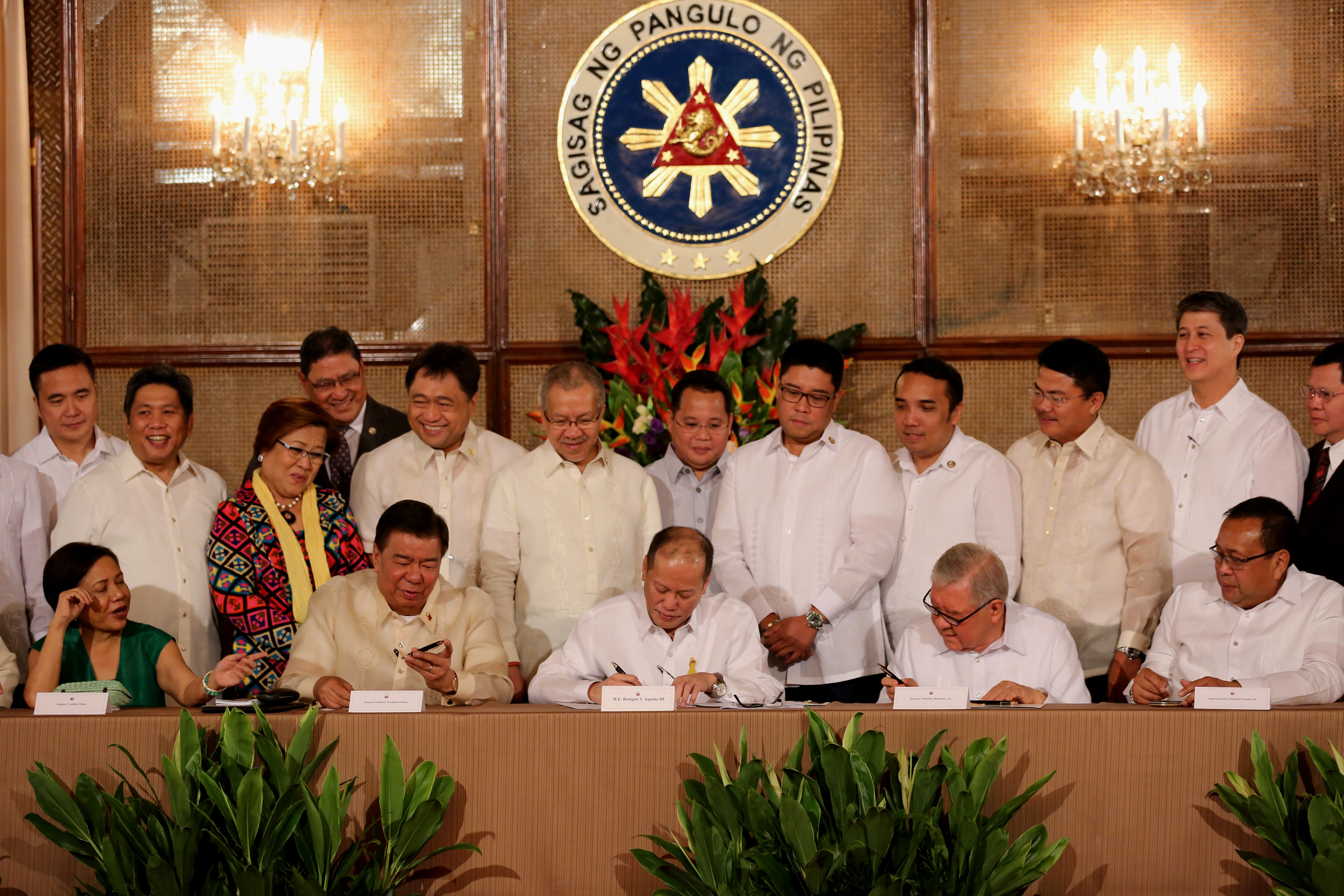 SIGNED. President Benigno S. Aquino III signs into law Republic Act No. 10667 or the Philippine Competition Act and the Amendments to the Cabotage Law at the Rizal Hall of the Malacañang Palace on July 21, 2015. Photo by Lauro Montellano Jr / Malacañang Photo Bureau    