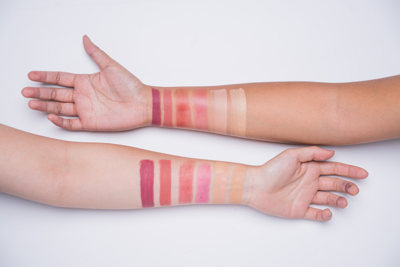 SWATCHES. Left to right: Shut Up & Kiss Me Moisturizing Matte Lippie in Forever Summer; Shut Up & Kiss Me Moisturizing Matte Lippie in Lost in Paradise; Pinch Me Summer-Proof Natural Lip & Cheek Stick in Cherry Glow; Pinch Me Summer-Proof Natural Lip & Cheek Stick in Berry Fresh; Good To Go Five Minute Fresh Face Summer-Proof Foundation & Concealer in Medium; Good To Go Five Minute Fresh Face Summer-Proof Foundation & Concealer in Light. 