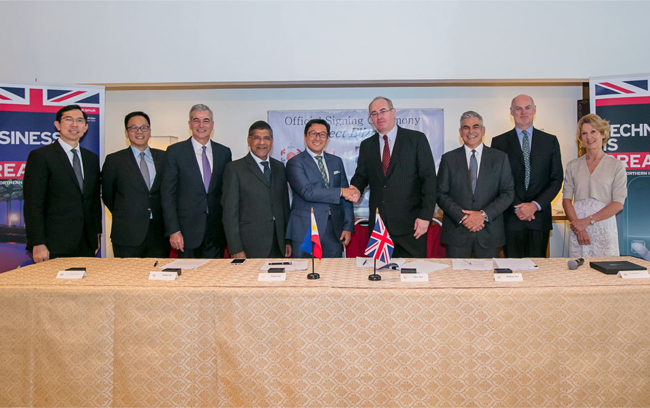 FORGING TIES. Top officials of the Ayala Group and STI, and UK officials pose for a photo after the formal signing of the agreement. Photo courtesy of Ayala Corporatoin. 
