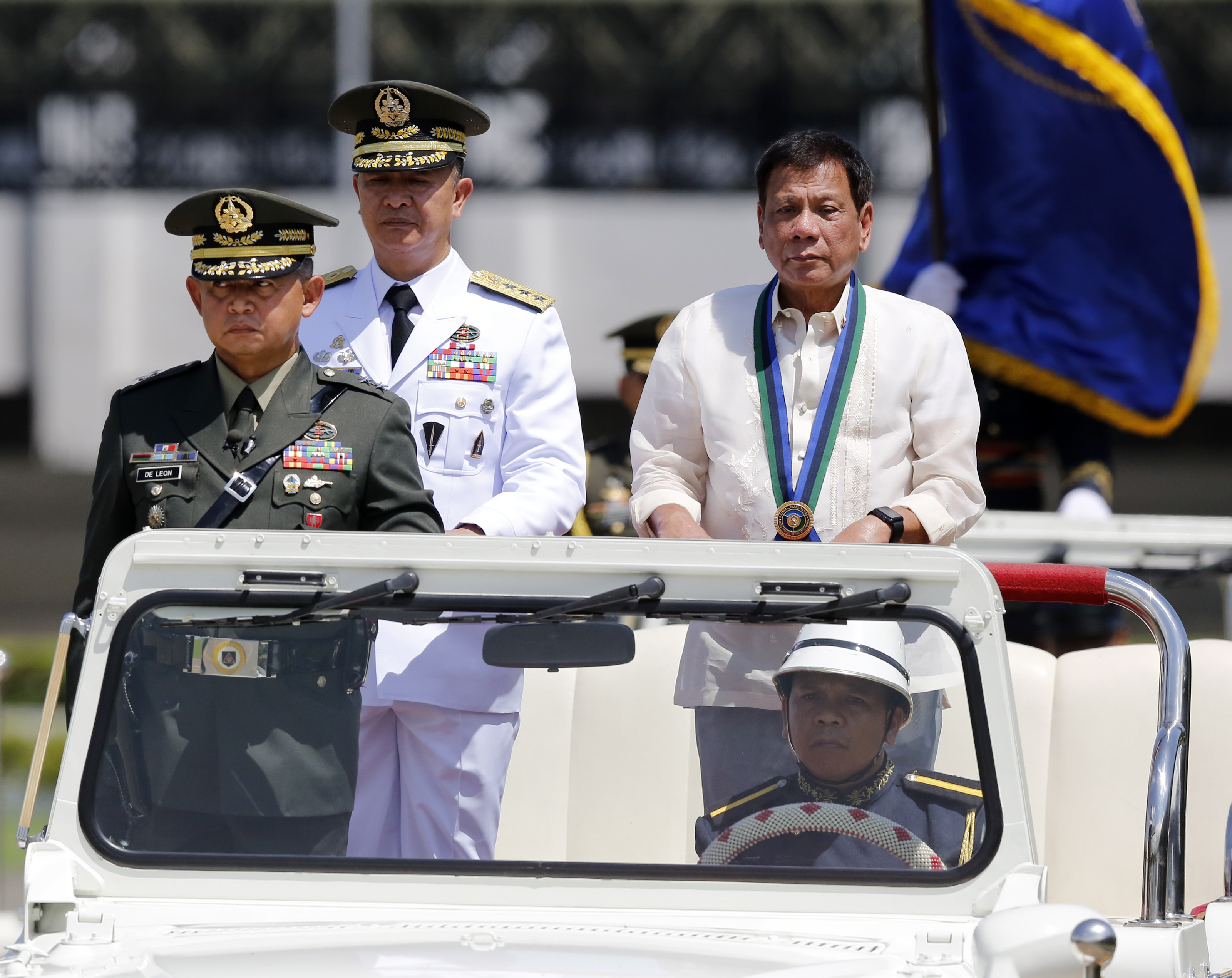 'WORKAHOLIC' DUTERTE? President Rodrigo Duterte (R) reviews honor guards during the AFP change of command ceremony on July 1, 2016. File photo by Francis R. Malasig/EPA 