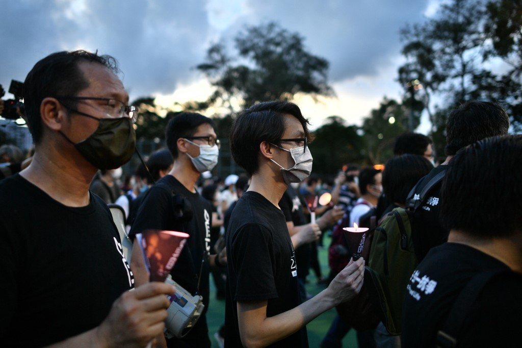 VIGIL. In this file photo, activists hold a candlelit remembrance after crossing downed barricades into Victoria Park in Hong Kong on June 4, 2020, after the annual vigil that traditionally takes place in the park to mark the 1989 Tiananmen Square crackdown was banned on public health grounds because of the COVID-19 pandemic. File photo by Anthony Wallace/AFP  