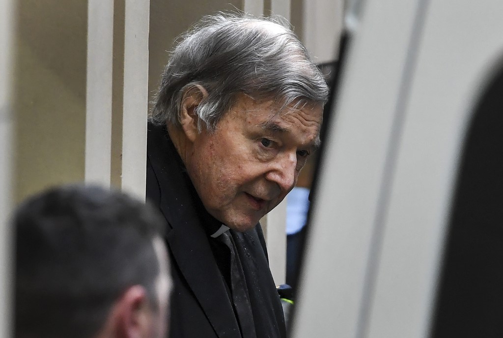 GEORGE PELL. Australian Cardinal George Pell (C) is escorted in handcuffs from the Supreme Court of Victoria in Melbourne on August 21, 2019. Photo by William West/AFP 