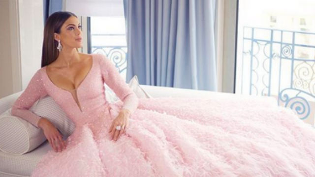 ETHEREAL. Miss Universe 2016 Iris Mittenaere in a pink ballgown by Filipino designer Michael Cinco at the Cannes Film Festival 2019. Screenshot form Instagram/@irismittenaeremf 