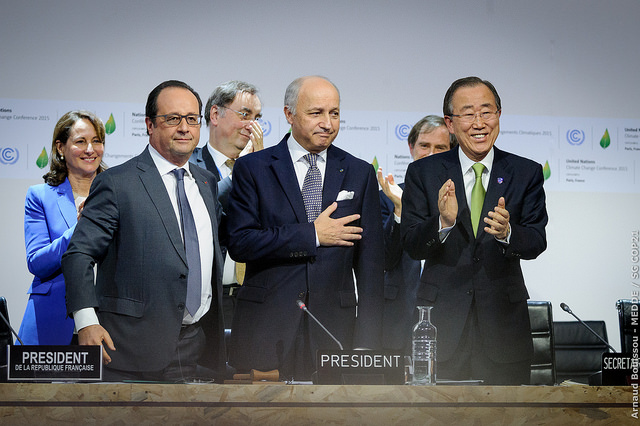 (Front row L-R) French President Francois Hollande, French Foreign Minister Laurent Fabius, and UN Secretary General Ban Ki-moon at a plenary session of the UN climate change conference in Le Bourget, France, December 12, 2015. Photo courtesy COP21 