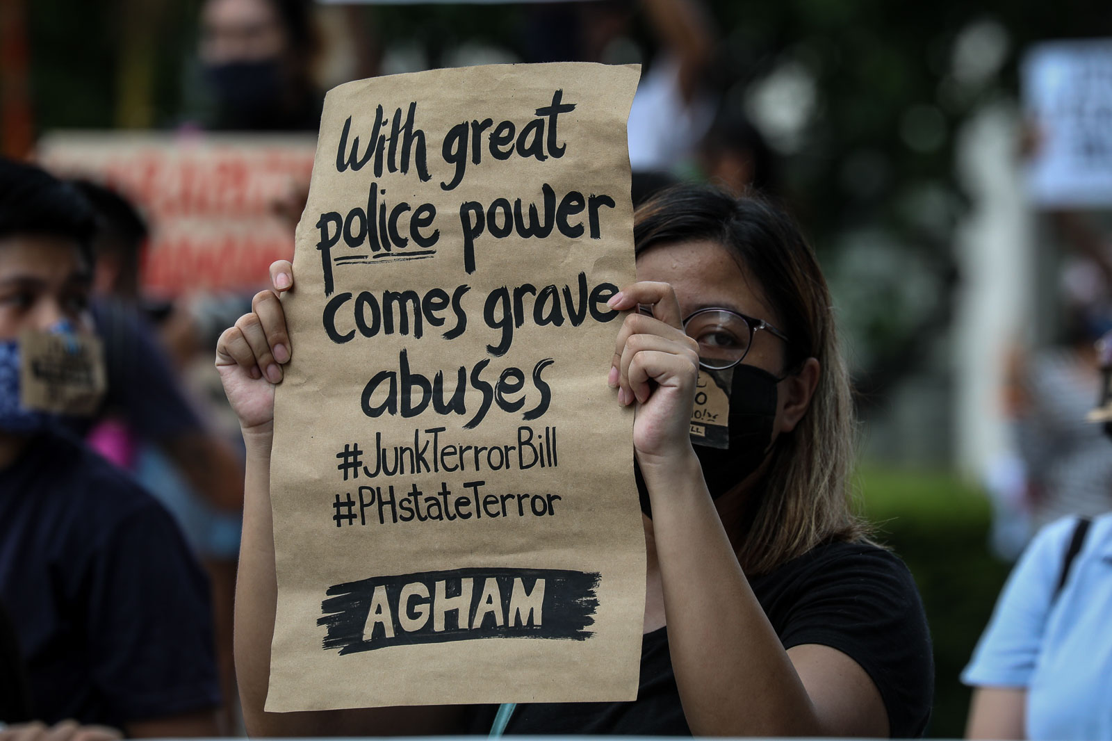 JUNK TERROR BILL. A protester raises a sign against the anti-terror law outside the University of the Philippines' Quezon Hall in Quezon City on June 3, 2020. Photo by Jire Carreon/Rappler 