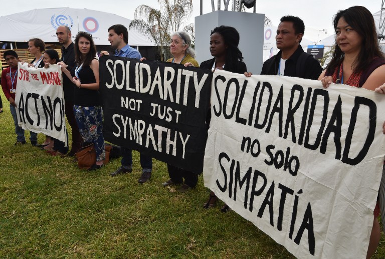 CLIMATE JUSTICE. A group of activists from different NGO's participate in a spontaneous rally to call for assistance to victims of typhoon Hagupit in the Philippines, during the UNFCCC COP20 in Lima, Peru.  