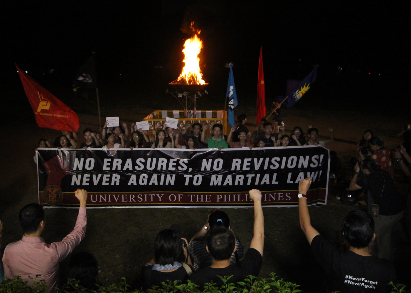 CELEBRATION. Teachers and youth groups of the University of the Philippines hold a bonfire at the UP Diliman Sunken Garden on November 9 to celebrate after the Sandiganbayan found Ilocos Norte 2nd District Representative Imelda Marcos guilty of 7 counts of graft. Photo by Darren Langit/Rappler   