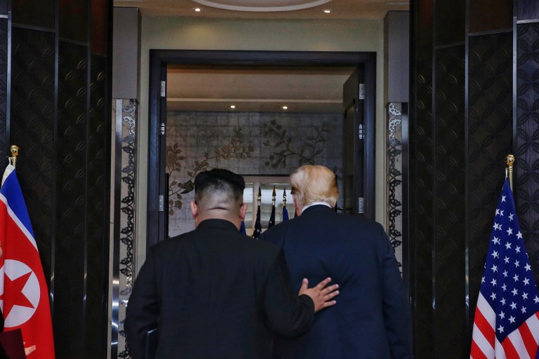 US-NORTH KOREA. This handout photo taken on June 12, 2018 and released by The Straits Times shows US President Donald Trump (R) and North Korea's leader Kim Jong-un (L) leaving after a signing ceremony during their historic US-North Korea summit, at the Capella Hotel on Sentosa island in Singapore.
AFP PHOTO / The Straits Times / Kevin LIM 