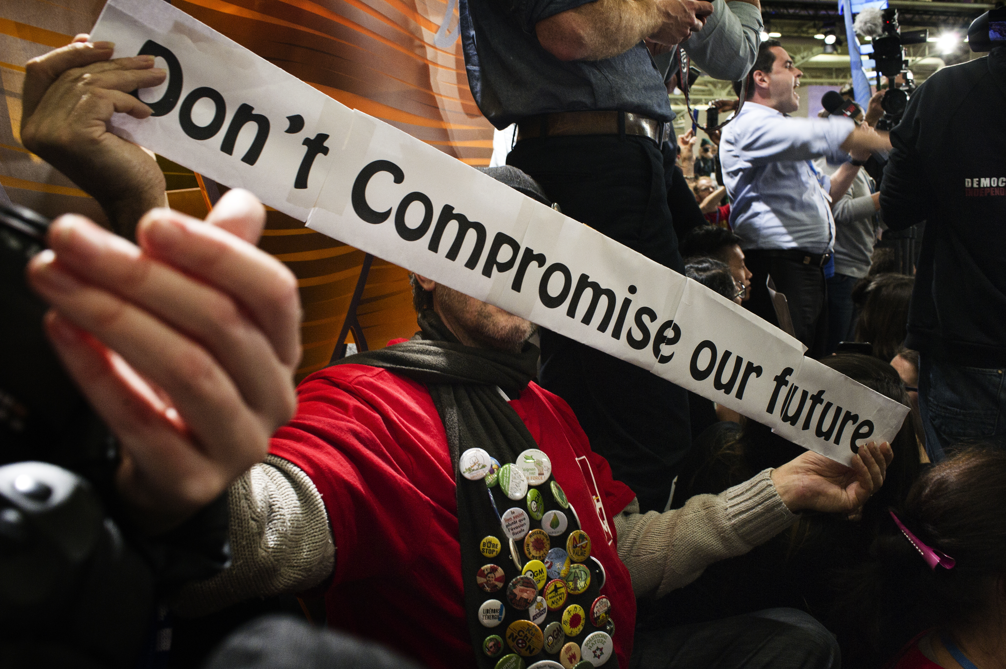 A protester holds a sign reading 'Don't Compromise our future' during a protest at the UN climate change conference in Le Bourget, France, December 9, 2015. Benjamin Géminel/COP21 