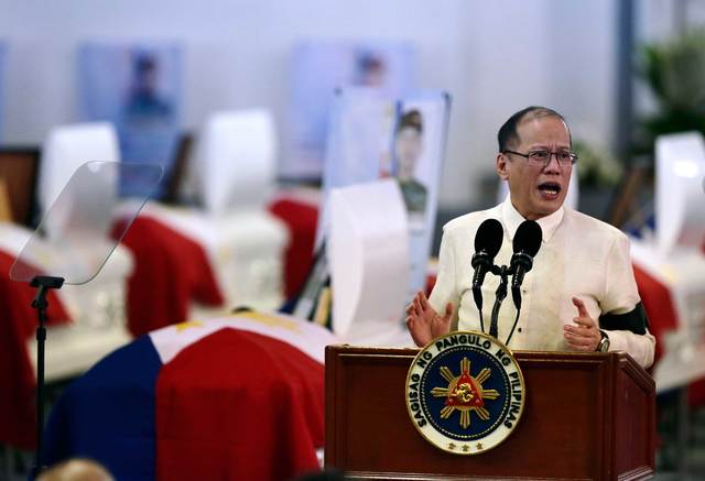 ALL-TIME LOW. The approval and performance ratings of President Benigno Aquino III, shown here at the necrological service for the SAF 44 on January 29, 2015, suffers a blow from the Mamasapano incident. Photo by Dennis Sabangan/EPA  