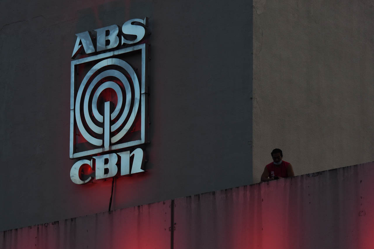 ABS-CBN SHUTDOWN. A man stands by the balcony of ABS-CBN's headquarters in Quezon City on May 5, 2020, the day the National Telecommunications Commission ordered the network to shut down. File photo by Angie de Silva/Rappler 