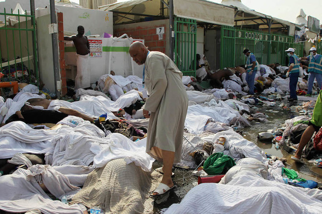 WORST EVER. A pilgrim walks amid the bodies of some of the pilgrims killed in a stampede in the Mina neighborhood of Mecca, Saudi Arabia. Photo by EPA 