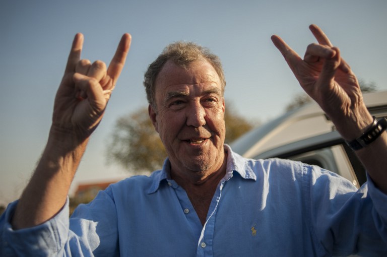 ON TRACK. Former Top Gear presenter Jeremy Clarkson gestures as he arrives at the Ticketpro Dome for the Clarkson, Hammond and May Live Show held in Johannesburg on June 10, 2015. File photo by Stefan Heunis/AFP  