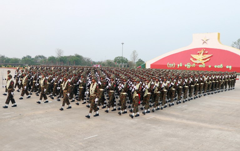 POLITICS? Myanmar soldiers march in formation during a military parade in Naypyidaw on March 27, 2018 to mark the 73rd Armed Forces Day. File photo by Thet Aung/AFP 