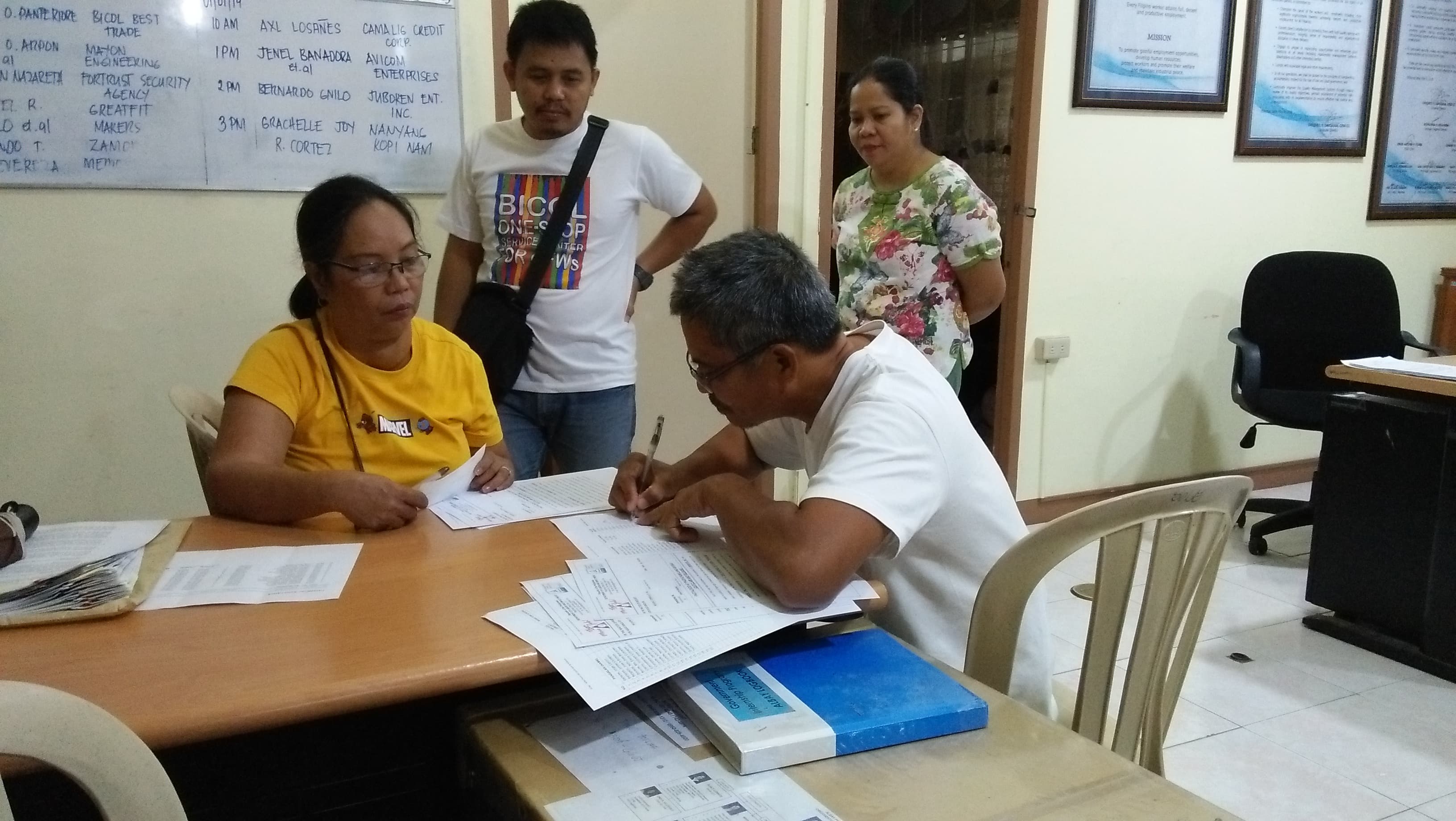 CLAIMED. Workers and the employer during the payment of separation pay witnessed by Ching Banania, SEADO and Raymund Avengoza of DOLE PFO Albay. Photo courtesy of DOLE Albay 