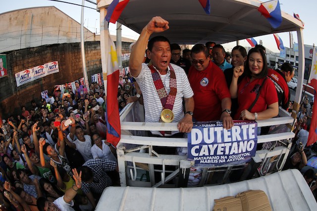 LEADING THE PACK. A file picture dated April 23, 2016 shows Filipino presidential candidate, Davao City Mayor Rodrigo Duterte (C) gesturing during an election campaign rally in Quezon City. Francis R Malasig/EPA 
