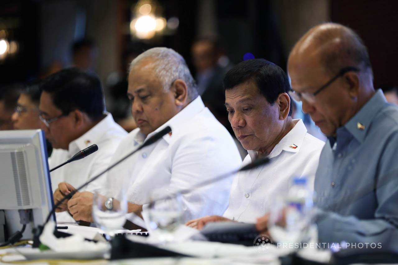 PALACE DECISION. It is Executive Secretary Salvador Medialdea's (left of President Duterte) office which signs travel authorities sent to Malacañang. Malacañang file photo 