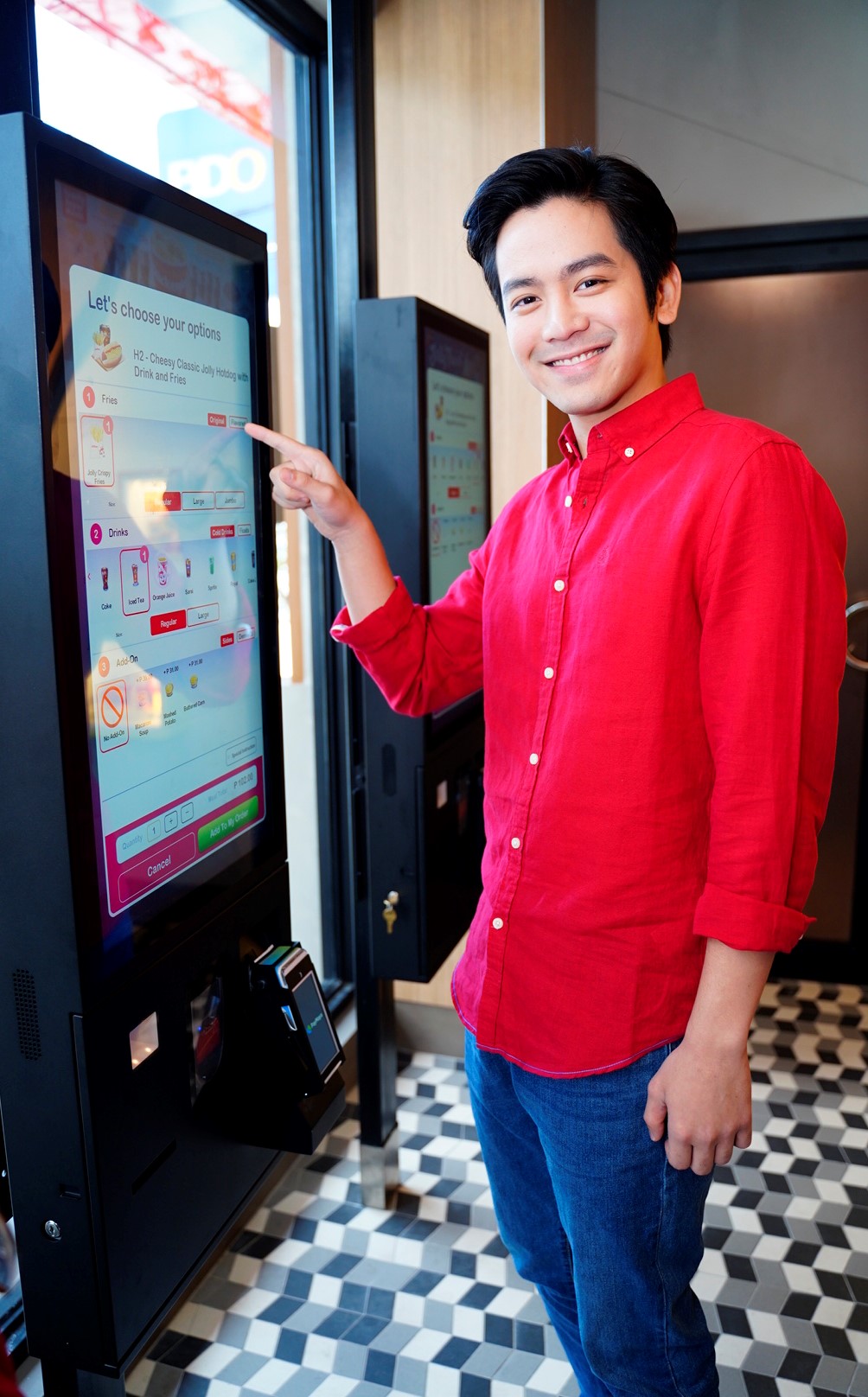SELF-ORDER KIOSKS. Joshua Garcia tries the self-order kiosk at the Level Up Joy Store in Katipunan. 
 
