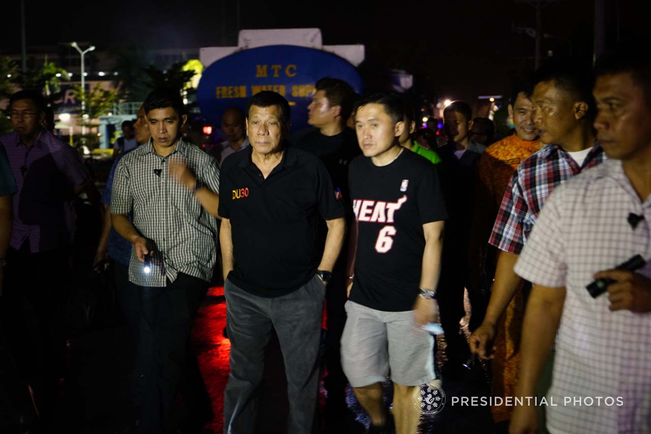 PRESIDENTIAL INSPECTION. President Rodrigo Duterte and Special Assistant to the President Christopher 'Bong' Go inspect the NCCC Mall in Davao City, where a fire raged on December 23, 2017. Malacañang photo 