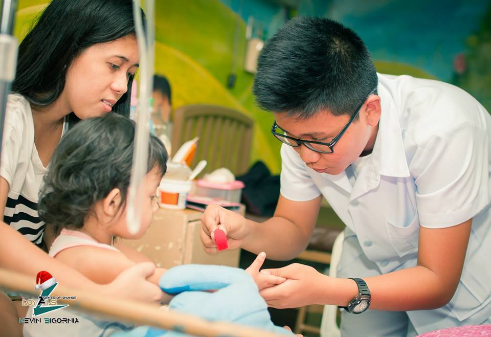 With patients in the Children's Ward of FEU Hospital last Christmas 2015. I also performed a couple of magic tricks as I approached each child in his bed. Photo courtesy of Christopher Valentin 
