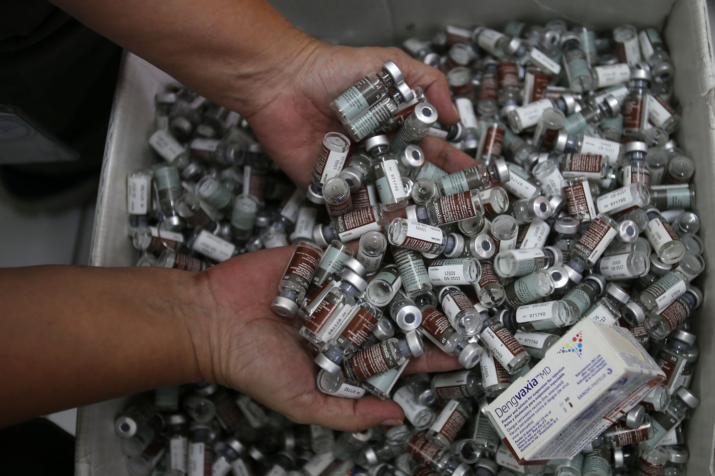 VACCINE. A health worker shows off used vials of Dengvaxia vaccine inside the storage facility of the local government health sector that was given to students during the school-based immunization in Manila on December 4, 2017. Photo by Ben Nabong/Rappler  