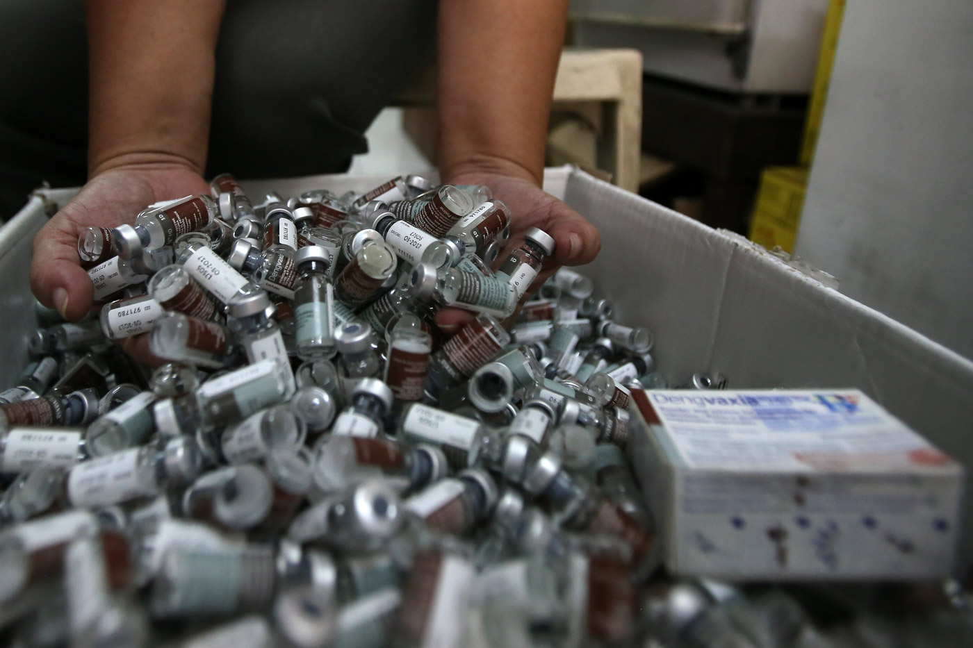 CONTROVERSIAL VACCINE. A health worker shows off used vials of Dengvaxia vaccine inside the storage facility of the local government health sector that was given to students during the school-based immunization in Manila on December 4, 2017. Photo by Ben Nabong/Rappler 