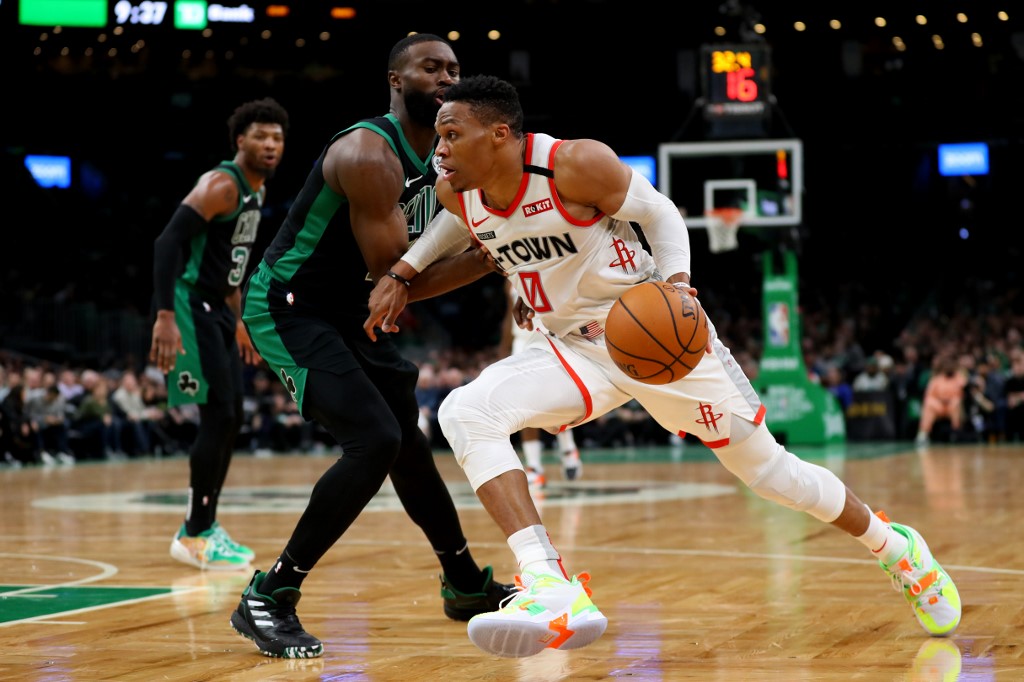 ESCAPE. Houston star Russell Westbrook drives to the basket against Boston's Jaylen Brown. Photo by Maddie Meyer/Getty Images/AFP 