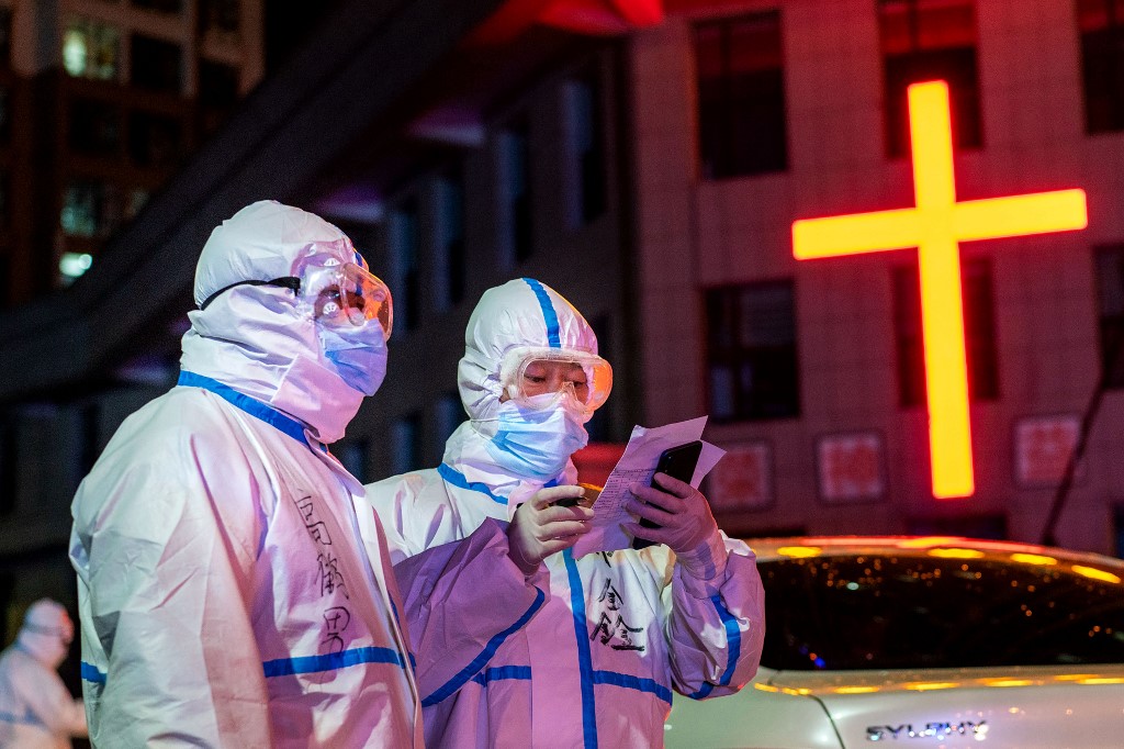 COVID IN CHINA. This photo taken on April 25, 2020 shows medical workers wearing protective gear looking for close contacts with patients that tested positive on nucleic acid tests for the COVID-19 coronavirus in Suifenhe in China's northeastern Heilongjiang province. Photo by STR / AFP 
