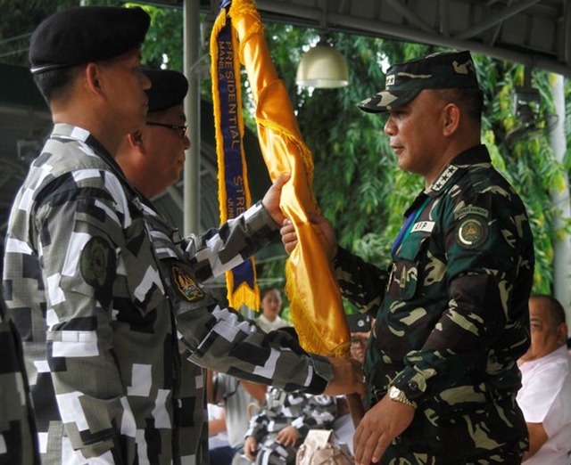 CHANGE OF COMMAND. Armed Forces of the Philippines Chief of Staff Lt. General Ricardo Visaya leads the turnover of command of the Presidential Security Group at the PSG Grandstand in Malacanang Park on July 2, 2016. Incoming PSG chief Lt. General Rolando Joselito D. Bautista (PA) receives the command flag from outgoing commander Rear Admiral Raul Ubando (PN). Photo by Marcelino Pascua/Malacañang PPD   