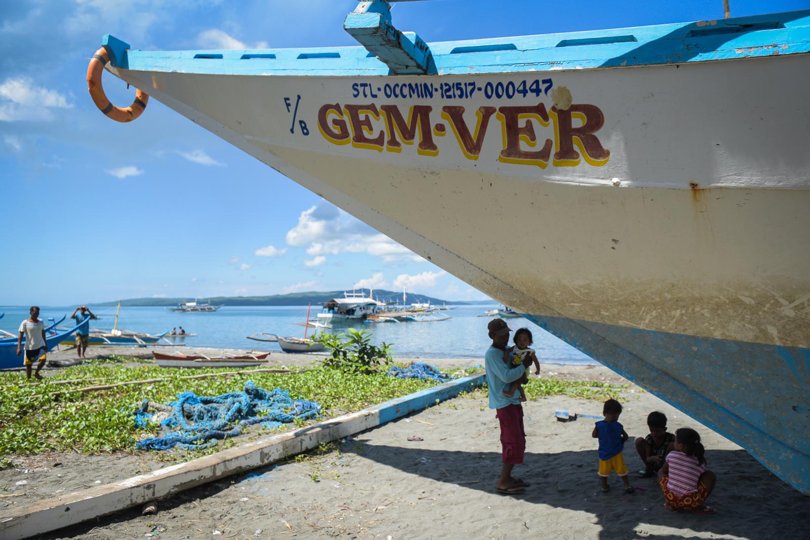 ORDEAL AT SEA. Children play around the dry-docked F/B Gem-Ver on June 21, 2019. Photo by LeAnne Jazul/Rappler 