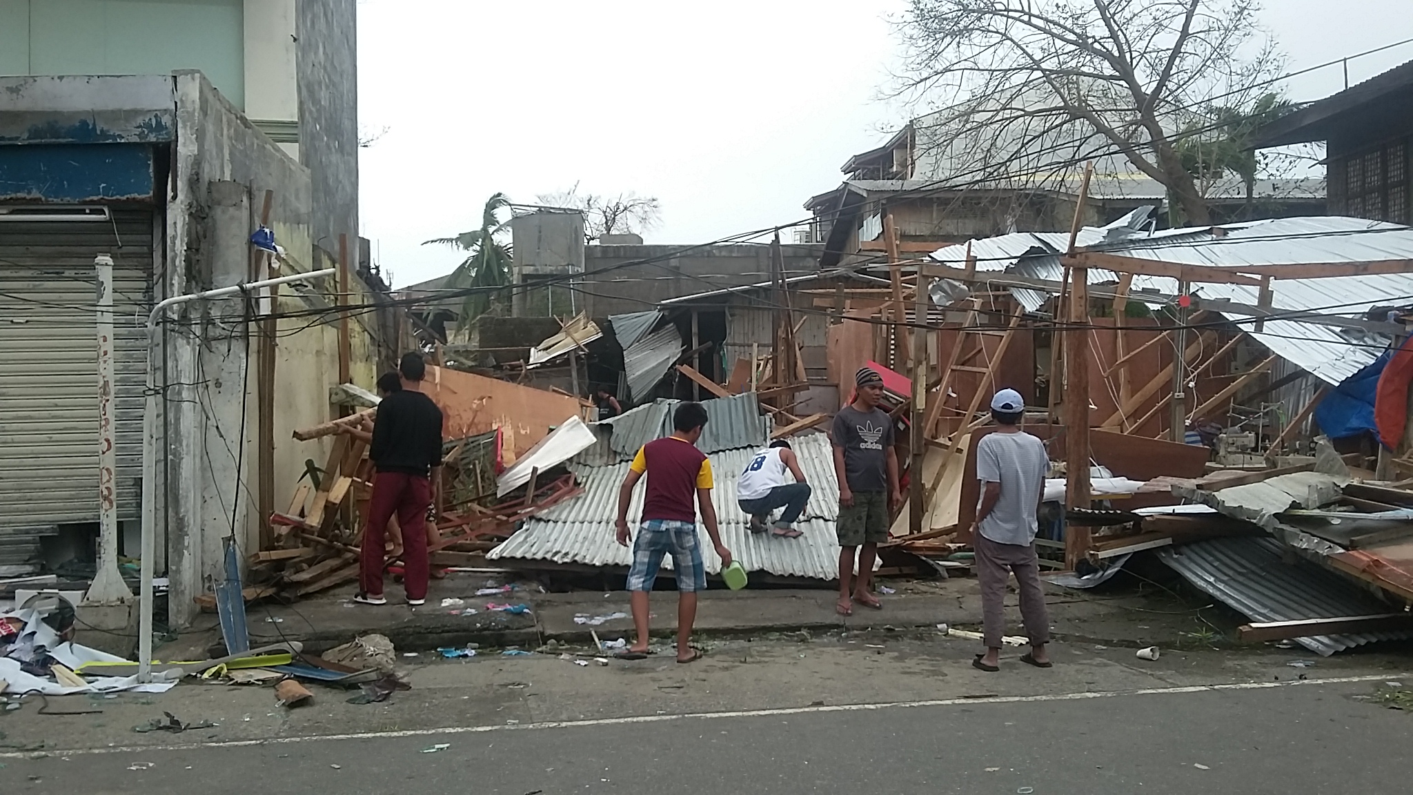 AFTERMATH. Residents in Tuguegarao City check houses destroyed by Typhoon Lawin (Haima), which was a super typhoon when it hit land on Wednesday, October 19. File photo c/o Adrian Portugal/Rappler 