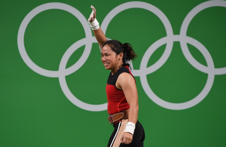 INSPRIATION. Hidilyn Diaz takes the responsibility of guiding young Filipino weightlifters. Photo by Goh Chai Hin/AFP  
