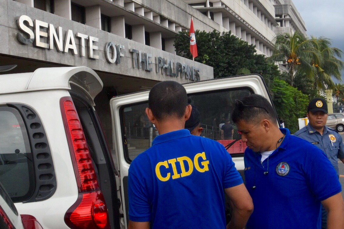 ON STANDBY. Members of the PNP Criminal Investigation and Detection Group at the Senate after the revocation of Senator Antonio Trillanes IV's amnesty. Photo by Angie de Silva/Rappler 