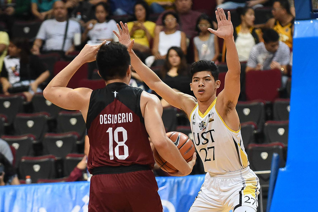 CRUNCH TIME. UST’s star rookie CJ Cansino and UP veteran Paul Desiderio try to keep their teams in the playoff hunt. Photo by Joaquin Flores/Rappler  