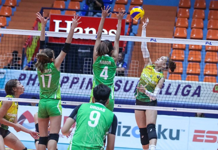 THRILLER. Cocolife’s Shang Berte goes for a kill over Smart’s Joyce Sta. Rita and Jasmine Nabor in the five-set thriller won by the Giga Hitters. Photo from PSL 