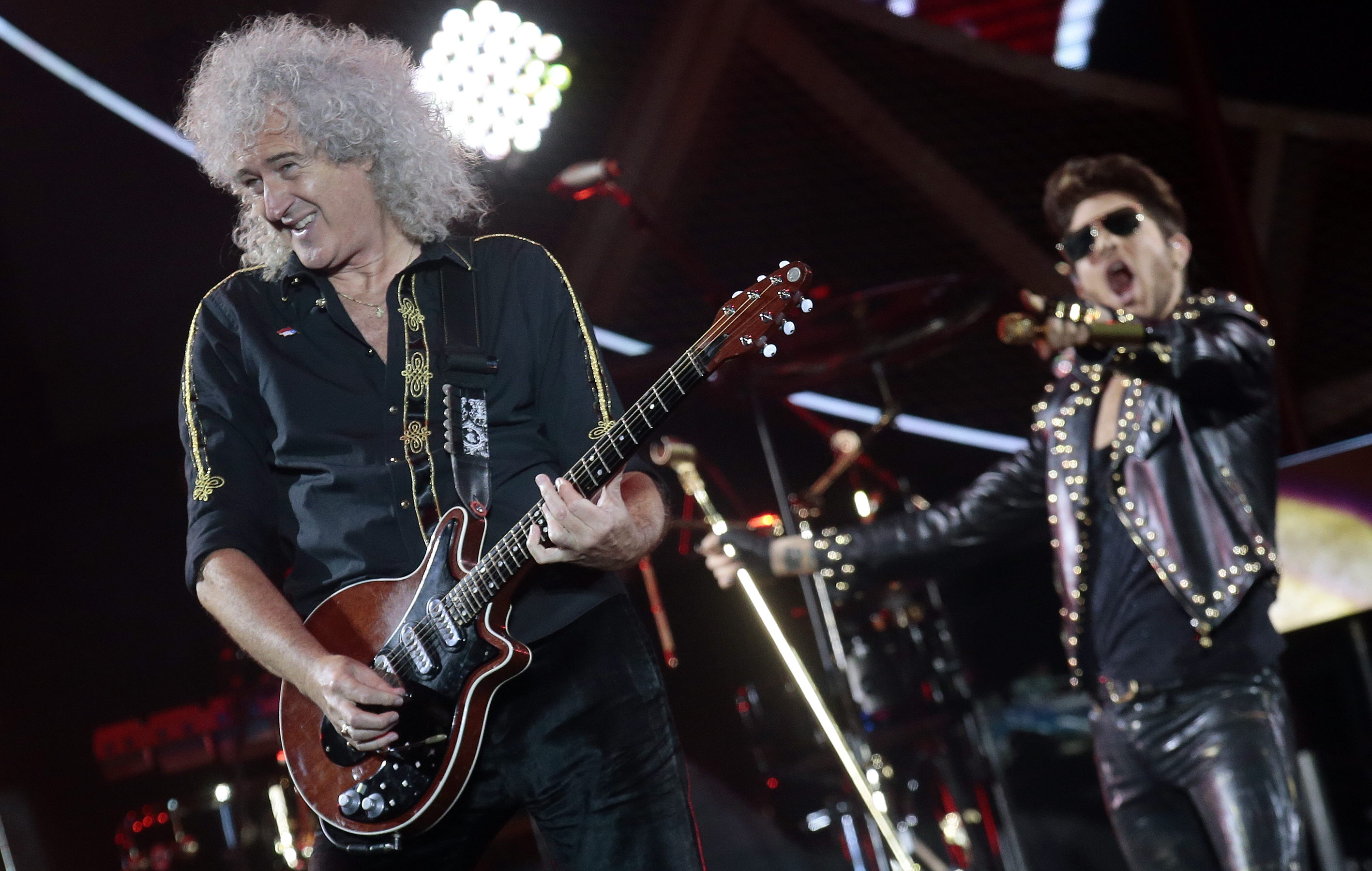 'UNAUTHORIZED USE.' The iconic British band Queen has protested the use of their hit, 'We Are the Champions' at the Republican National Convention. In this file photo, Brian May performs next to singer Adam Lambert during a concert with British band Queen as part of their tour 'Don't Stop Them Now' in Chile, 2015. File photo by Felipe Trueba/EPA 