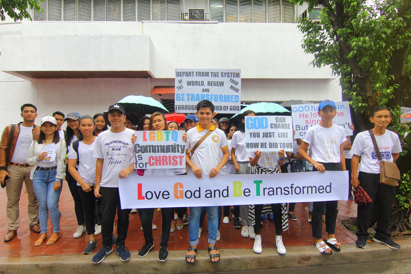 'BE TRANSFORMED'. Members of Jesus is our Shield church holds a protest against Metro Manila Pride March outside Marikina Sports Center on June 30, 2019. Photo by Sophia Sibal/Rappler 
