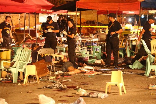 EXPLOSION. SOCO investigators at the Roxas Night Market in Davao City following an explosion on September 2, 2016. Photo by Manman Dejeto/AFP 