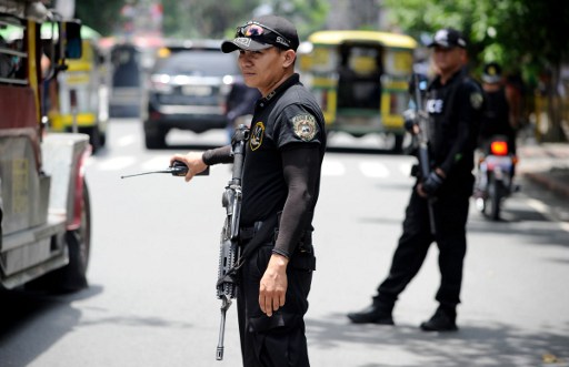 SECURITY FORCES. Special Weapons and Tactics (SWAT) personnel patrol the streets of Manila on September 3, 2016 as Davao city and central Manila is placed on high alert following the Davao City blast. AFP PHOTO / NOEL CELIS 